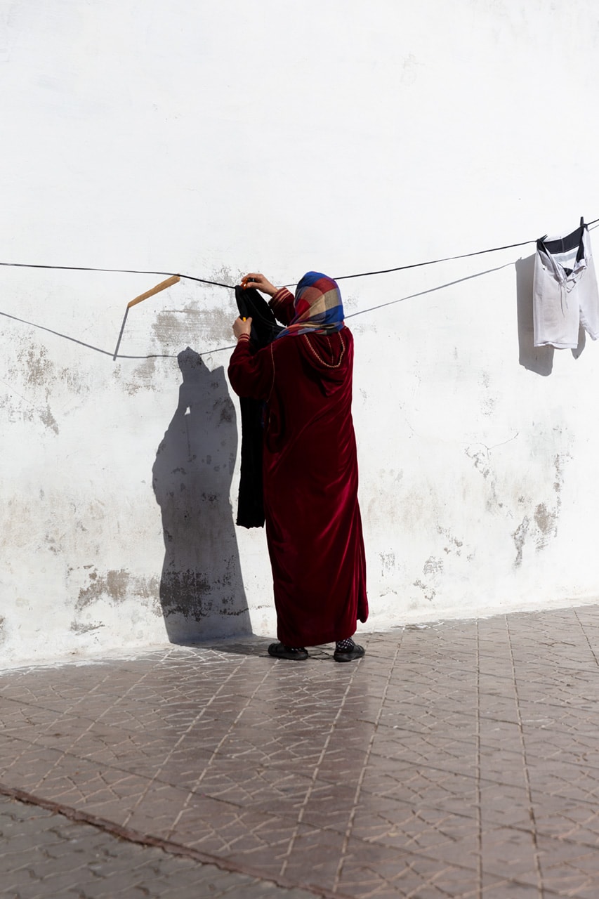 Woman with Laundry, by Julian Mullan